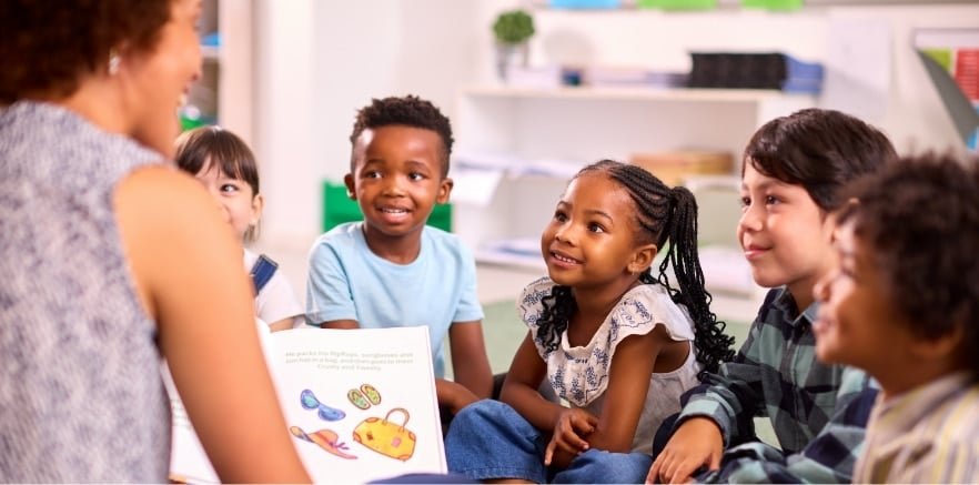 Group of children listening to a children's book